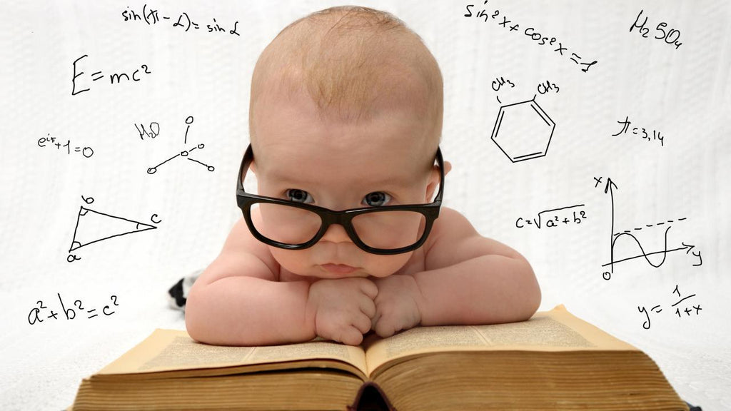 Smart Baby reading book wearing glasses