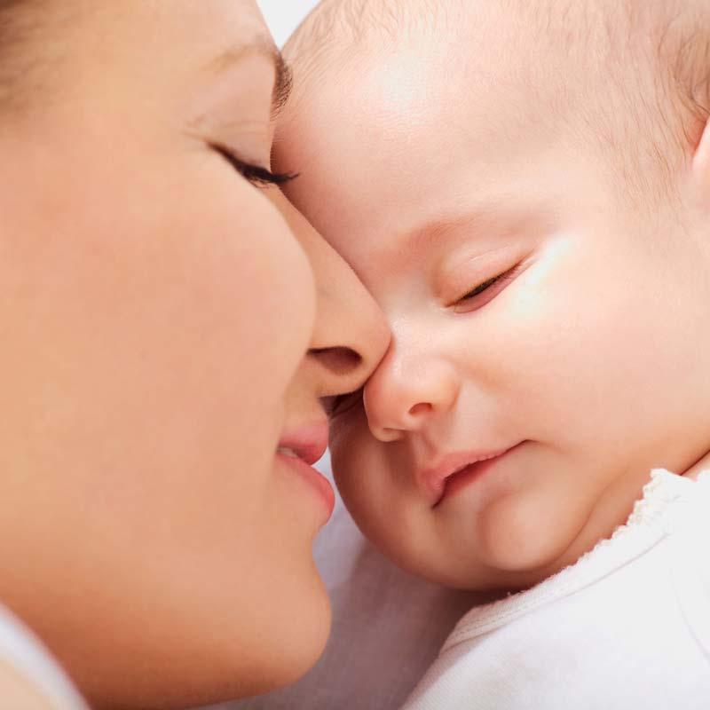 Mother-feeding-vegan-formula-to-baby - Grow Organic Baby